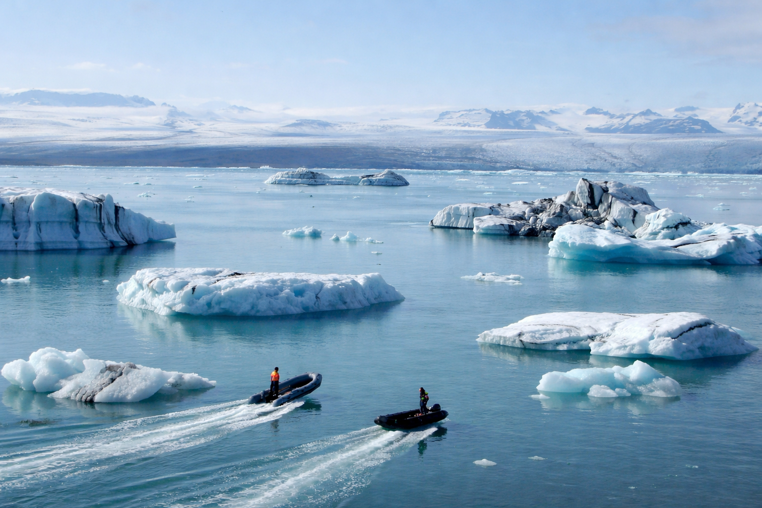 Jökulsárlón glacier lagoon with icebergs floating during summer daylight